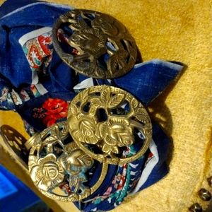 Four brass napkin holders Rose design